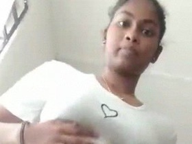 Tamil beauty teases with her hairy pussy while stripping