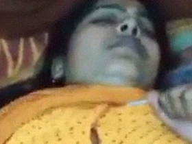 Watch a beautiful Indian woman in a sari indulge in steamy sex