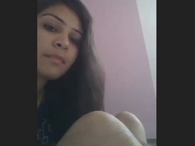A South Asian woman reveals her small and tight white genitals in an erotic video