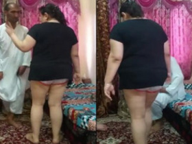 Arousing wife performs a dance for an Arab gentleman