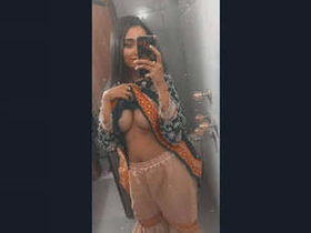 Alluring women with large breasts perform in a captivating display