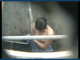 A girl from the neighborhood gets caught in an outdoor shower