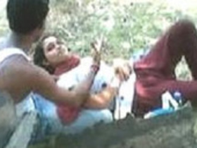 Indian lovebirds enjoy a romantic park outing