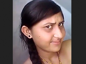 A tantalizing village beauty in action
