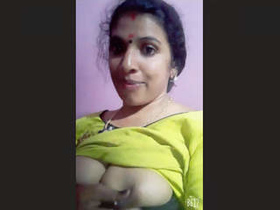 Indian auntie with big breasts gets naughty