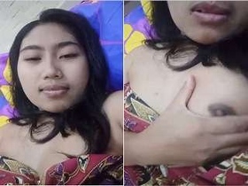 A pretty girl flaunts her breasts and pussy in a seductive manner