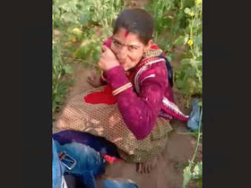 A village couple's intimate moment in a mustard field