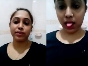 Arousing strip show in the restroom ends with an intense climax