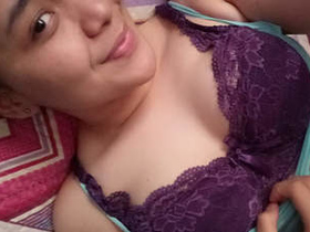 Desi girl in hijab reveals her breasts and engages in sexual activity