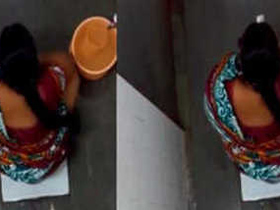 Watch a stunning Indian woman pee and clean herself in a public restroom