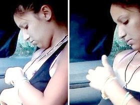 A young woman performs oral sex on a man in a car