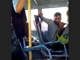 A man masturbates on a public bus while the female conductor records him