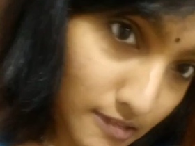 A stunning Tamil girl bares her naked breasts in a steamy MMS video