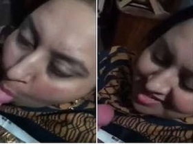 Busty Auntie gives a sensual blowjob