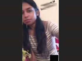 A lovely girl displays her large breasts and intimate area during a video call