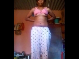 Young village women perform a seductive strip show