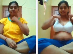 A college girl shares her large breasts in a self-shot video for her boyfriend