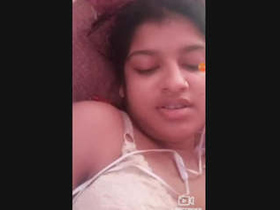 A seductive Indian beauty reveals her breasts and intimate area