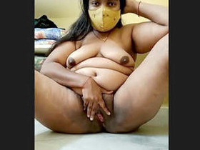 Indian housewife showcases her attractive breasts and intimate parts in this sensual video