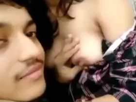 A fervent kiss escalates into passionate breast sucking and kissing