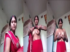 A Bihari woman displays her breasts on camera