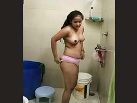 A lovely Indian girl takes a bath in this video