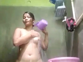 Indian wife indulges in naughty behavior while bathing