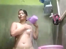 Indian wife indulges in naughty behavior while bathing