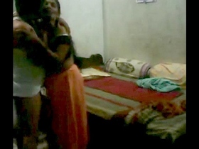 Traditional Indian couple engages in intimate bedroom activities