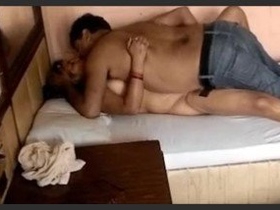 A mature Indian couple indulges in intimate moments at a hotel