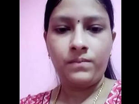 Desi bhabi reveals her large breasts in a village setting