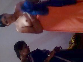 Indian aunt's wardrobe change caught on camera with focus on her breasts