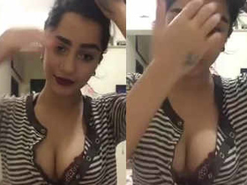 Sexy cat shows off her cleavage and chats with fans