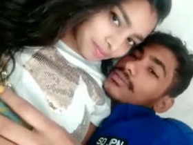 A loving pair shares a romantic moment at home