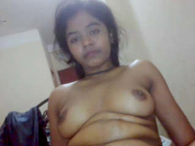 An attractive Indian woman participates in a private video recording of an intimate nature
