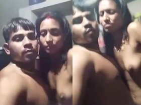 Naked couple engages in standing sex