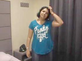 An alluring Indian woman sensually disrobes and performs oral sex