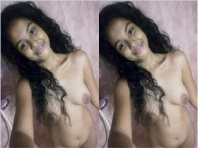 A stunning girl flaunts her nude body in front of the camera