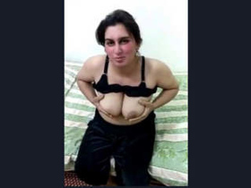 A stunning Pakistani Pathan milf displays her large breasts for her partner