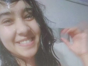 Nude Indian teen in wet see-through bra takes solo selfie in bathroom