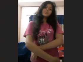 Attractive young woman displays her breasts