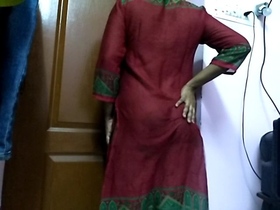 Indian matron undressing for camera in private room