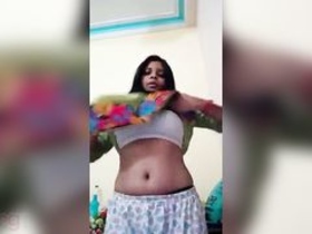Watch a sexy Desi girl with big boobs in a steamy scene from the movie 
