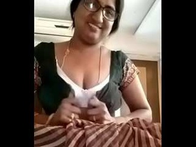 Indian village woman with beautiful curves displays her assets