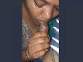 Indian wife gives a blowjob in a steamy video