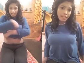 Alluring girl reveals her curves and sways her breasts in a live performance with audio