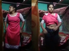 A country girl records a video for her lover in a rural village