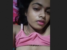 A Desi girl flaunts her breasts and pussy in a solo video