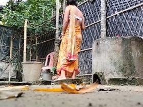 Village beauty takes nude bath in the countryside