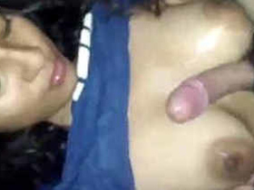 Adorable busty girl gives a sensual blowjob